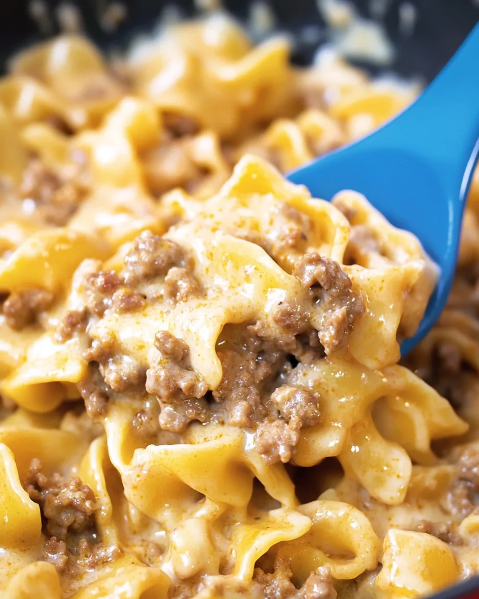 A fork is in a bowl of pasta.