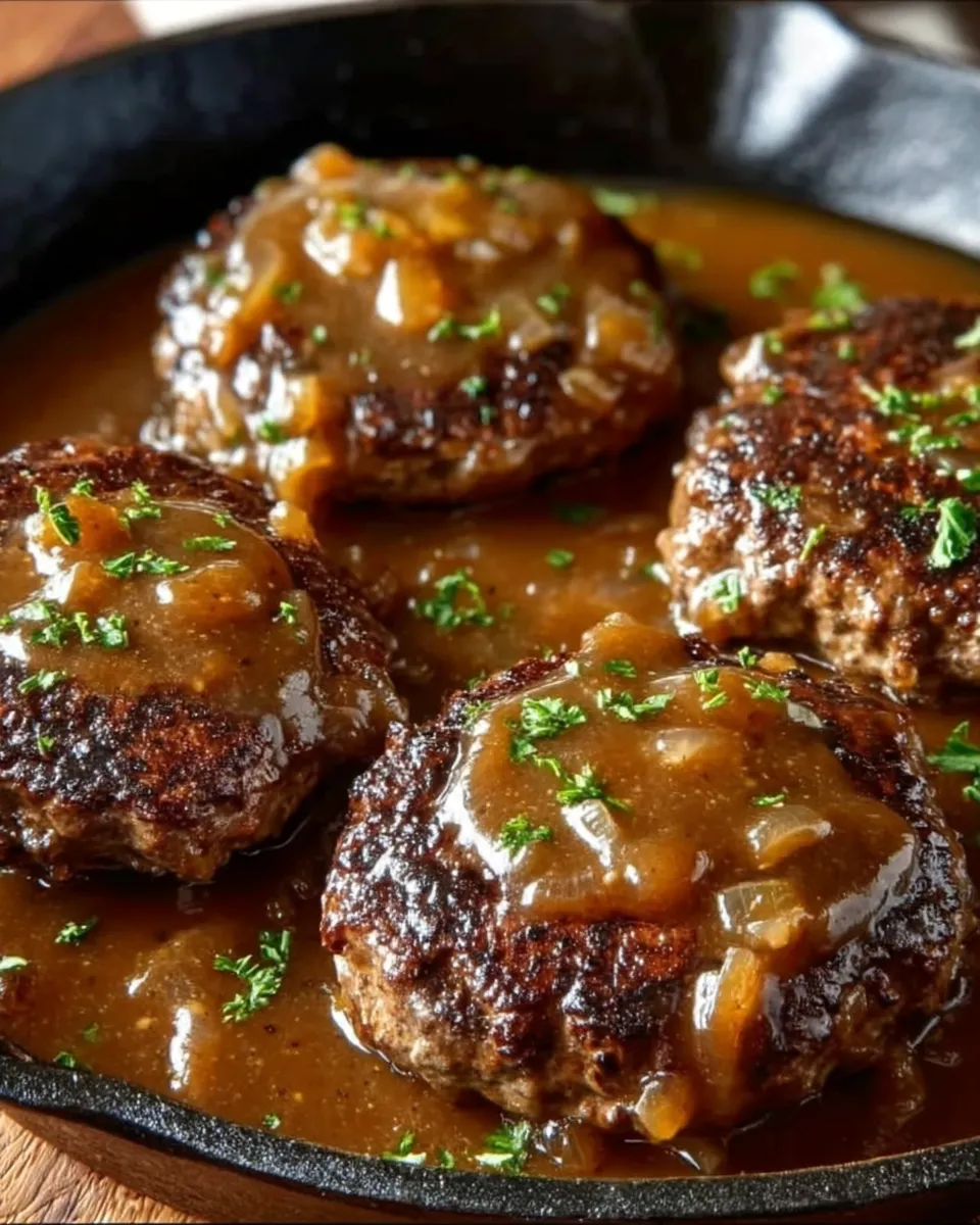 A plate of meat with gravy.