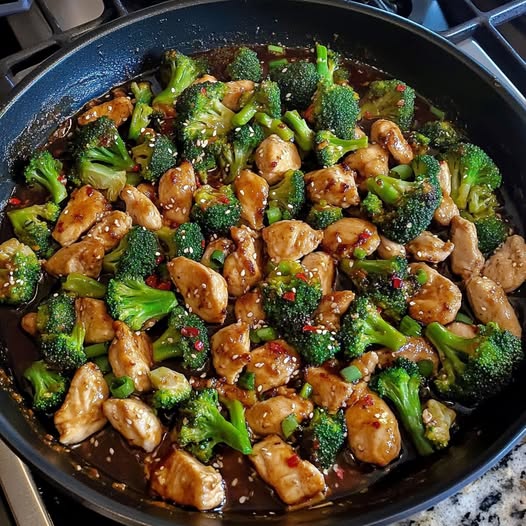 A pan of chicken and broccoli.