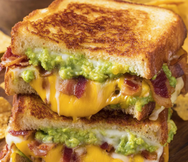 A sandwich with bacon and avocado.