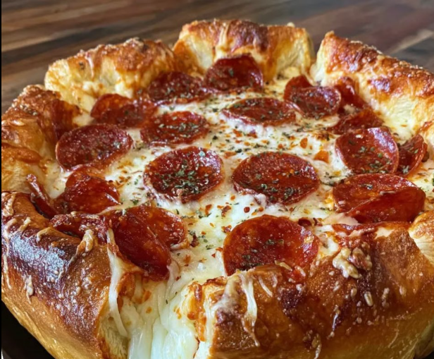A pizza pie with pepperoni and cheese.