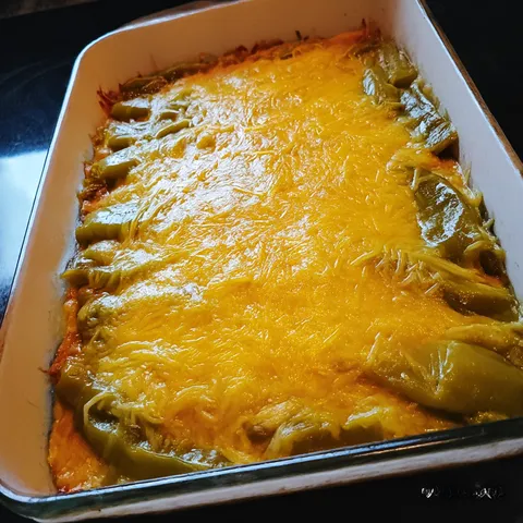 A dish of food with a yellow sauce.