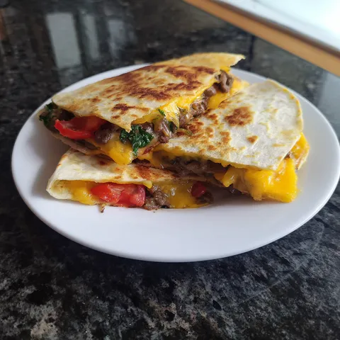 A white plate with a sandwich on it.