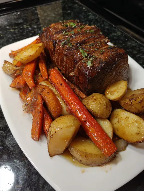 A plate of meat and vegetables.