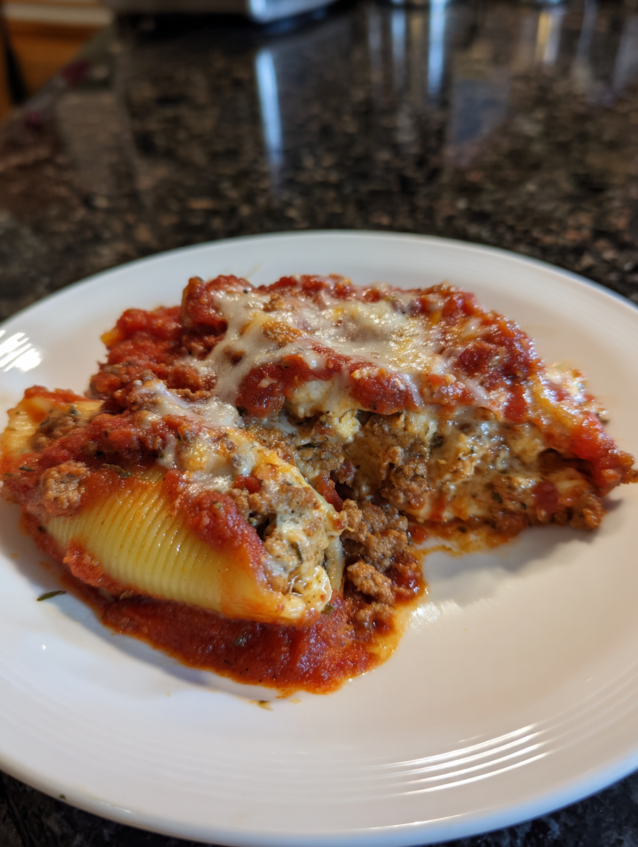A plate of lasagna with meat and cheese.