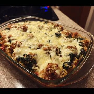 A glass dish with a casserole in it.