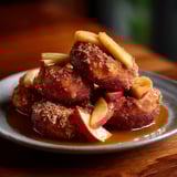 A plate of food with a syrup sauce.